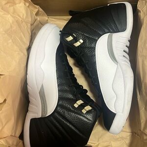 Used air Jordan 12s retro black and white.